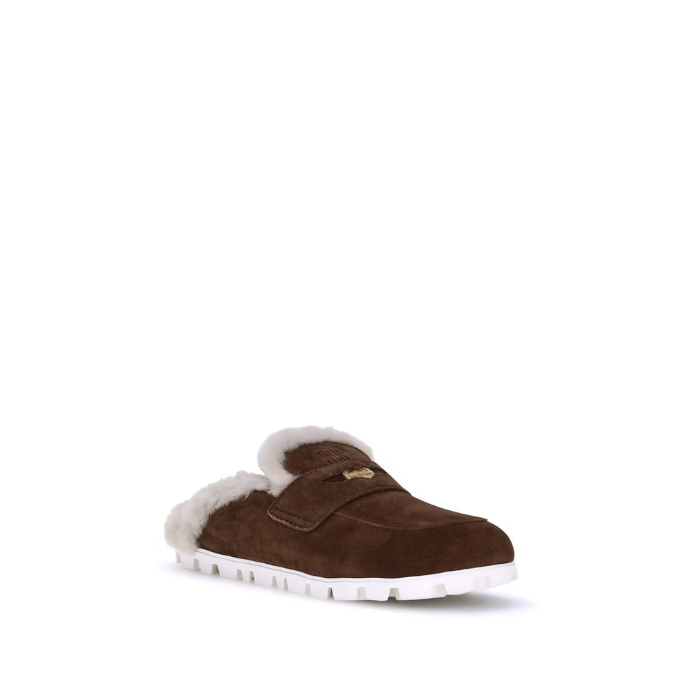 Mules Miu Miu en cuir beige