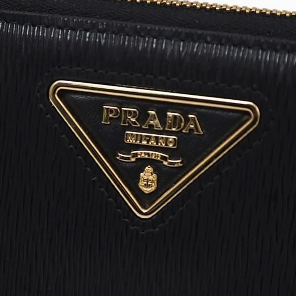 Portefeuille cuir logo triangulaire marron Prada