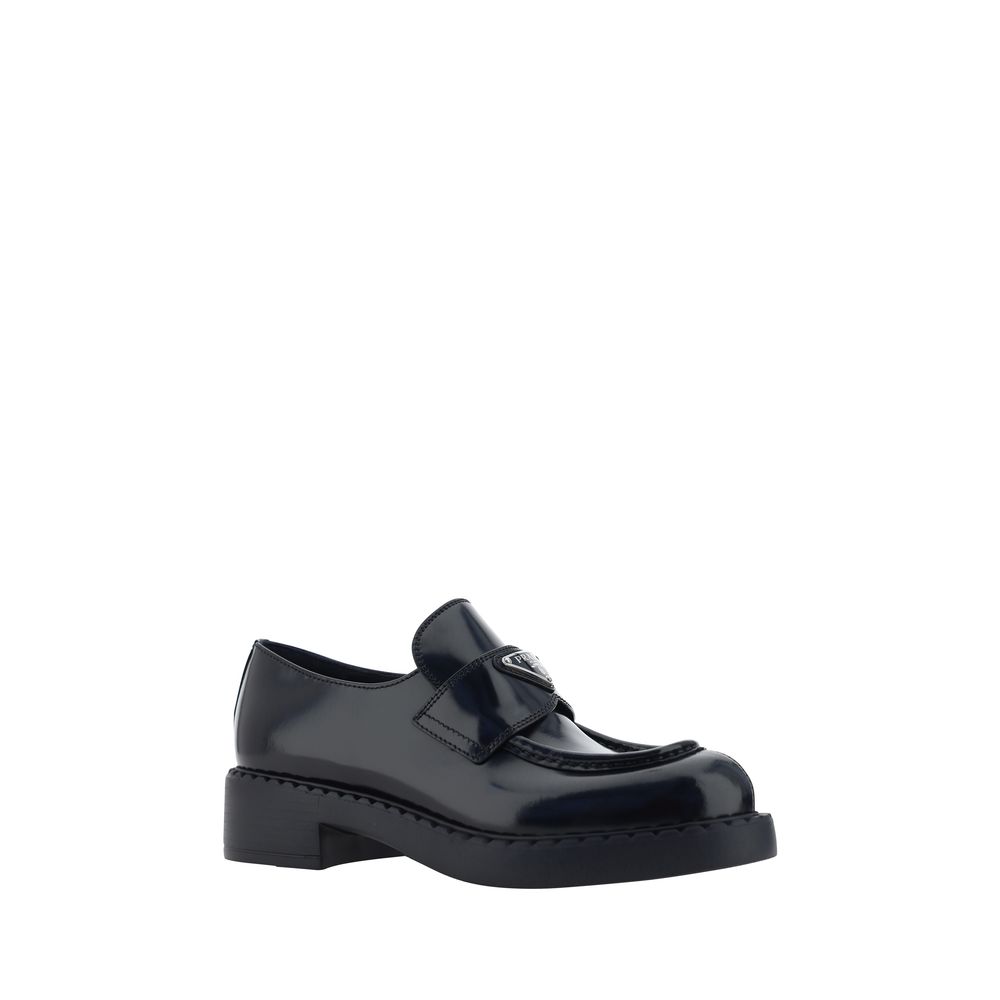 Loafers Prada à plaque triangulaire noires
