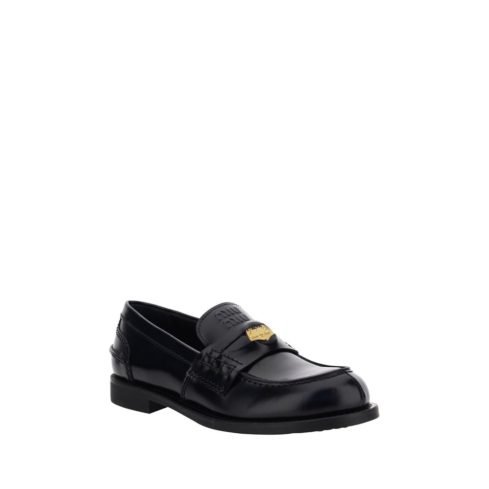 Loafers Miu Miu en cuir noires