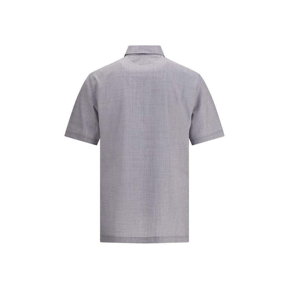 Polo Brunello Cucinelli en laine vierge bleu